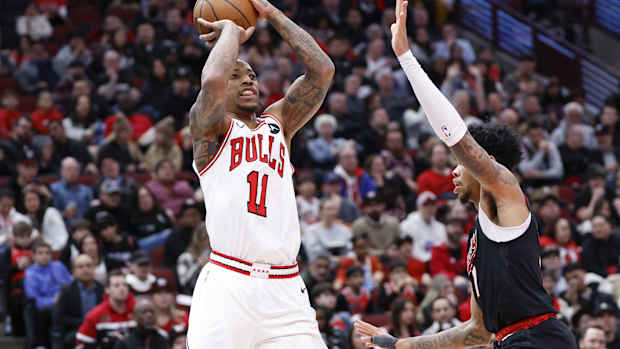 Chicago Bulls forward DeMar DeRozan (11) shoots against Portland Trail Blazers guard Anfernee Simons (1) during the first half at United Center. 